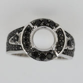 Sterling silver semi mount ring setting with halo design and black spinel accents, featuring an empty round center for personalization.